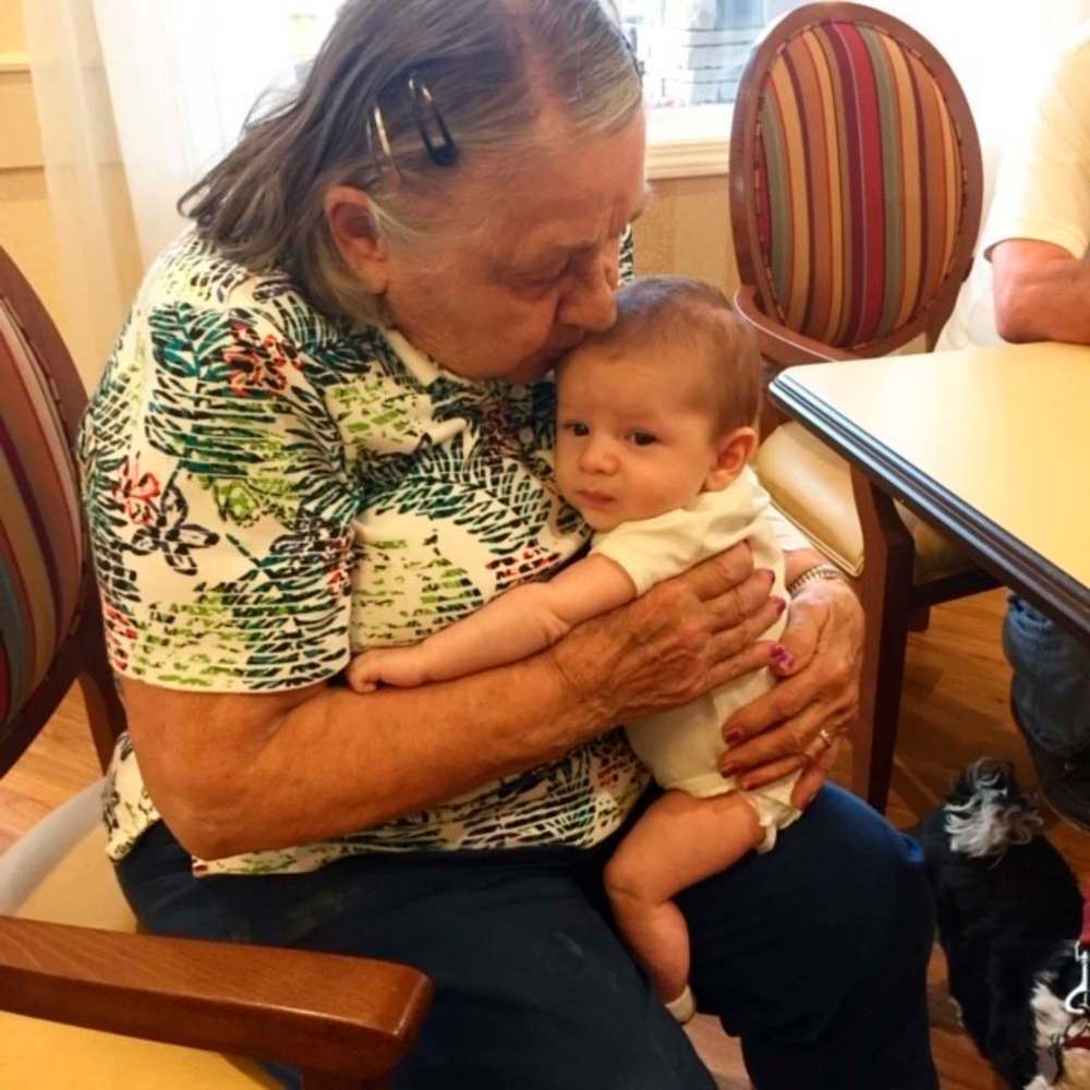 Henderson, above, cuddling her great-grandson Nash Lupkey, also enjoyed the great outdoors, below.