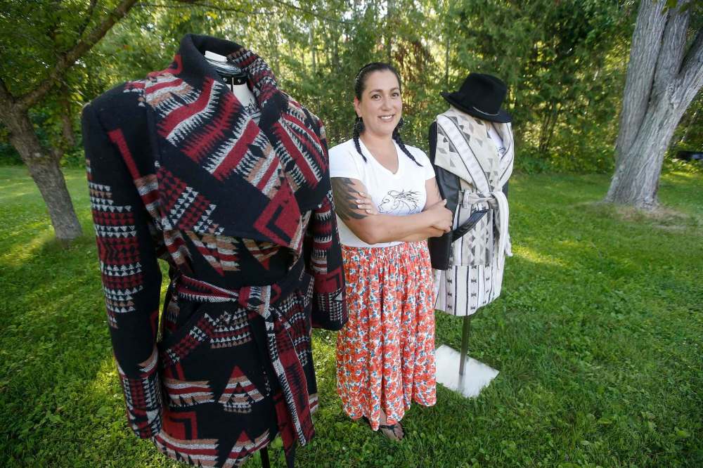 Near her home in Beaconia, where she works for the band council at Brokenhead Ojibway Nation, Sinclair shows off jackets from her Pretty Windy Designs. (John Woods / Winnipeg Free Press)