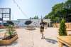 MIKAELA MACKENZIE / WINNIPEG FREE PRESS
Scott Angus walks drinks and food back to his table at The Garden 955, a new beer garden at 955 Portage Avenue.