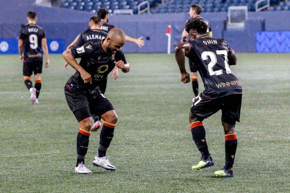 Valour FC photo
Andy Baquero (left) and Raphael Ohin of Valour FC dance in the rain following Ohin’s first-half goal Saturday night at IG Field.
