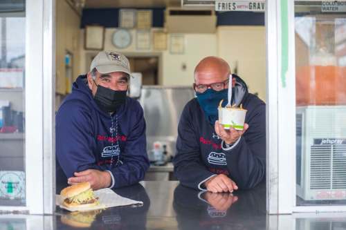 Cousins Dean Lambos (left) and Trif Lambos are the second-generation family owners of the Dairi-Wip Drive-In at 383 Marion St. It was started by their fathers and their uncle in 1958. (Mikaela MacKenzie / Winnipeg Free Press)