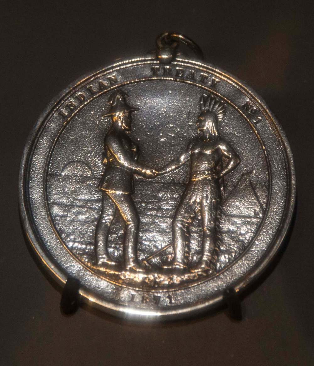 MIKE DEAL / WINNIPEG FREE PRESS A replica of a Treaty Medal No. 1 on display at the Manitoba Museum. It commemorates the Treaty negotiated at Lower Fort Garry in 1871. 170802 - Wednesday, August 02, 2017.