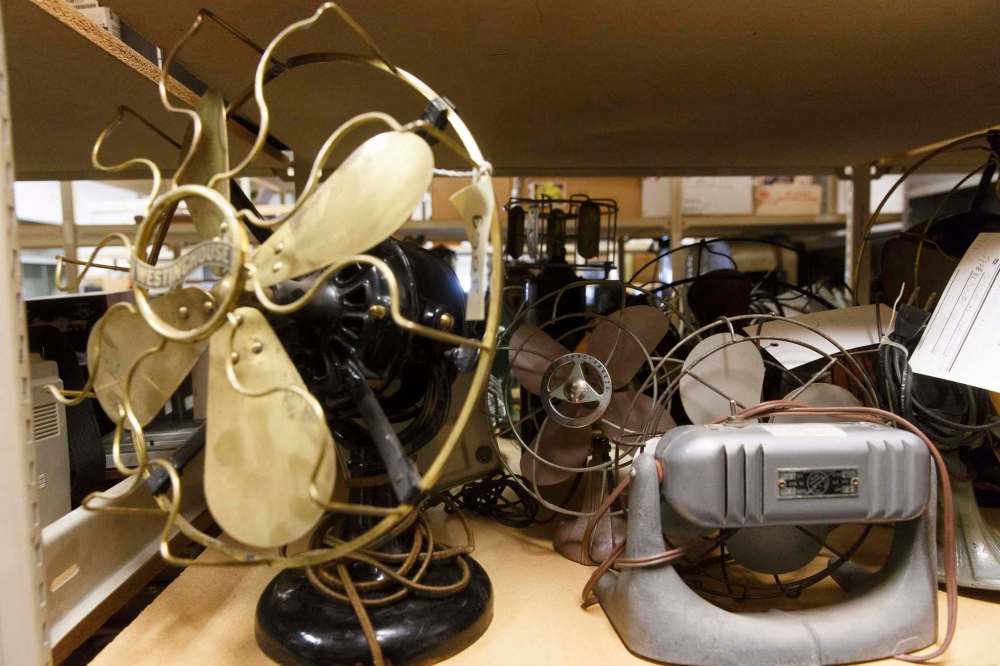 MIKE DEAL / WINNIPEG FREE PRESS
The museum has shelves of donated items that need to be catalogued and repaired, including several old fans.
