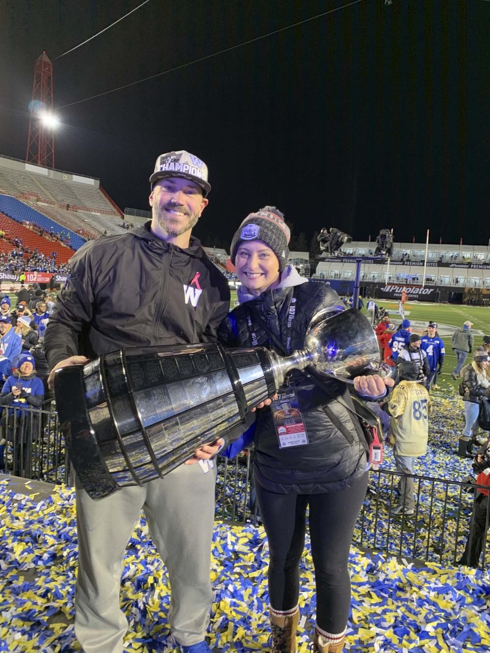Buck Pierce and his wife Lori hold the Grey Cup in 2019. (Supplied)