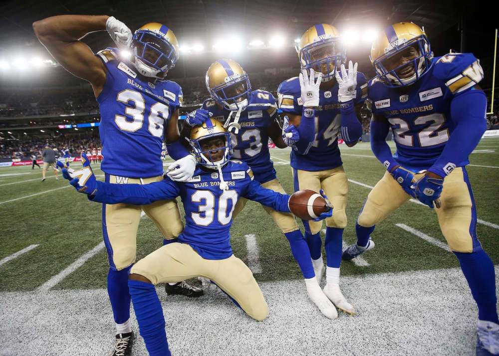Mercy Maston (from left), Winston Rose, Anthony Gaitor, Marcus Sayles and Chandler Fenner celebrate an interception against Calgary in 2019. Maston is out for the season after tearing his right Achilles on Sunday. (John Woods / The Canadian Press files)
