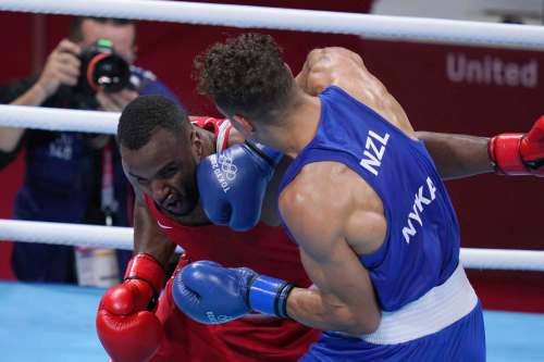 Frank Franklin II / The Associated Press
After taking it on the chin, Youness Baalla, of Morocco, tried to take a bite out of his opponent &mdash; New Zealand&rsquo;s David Nyika.