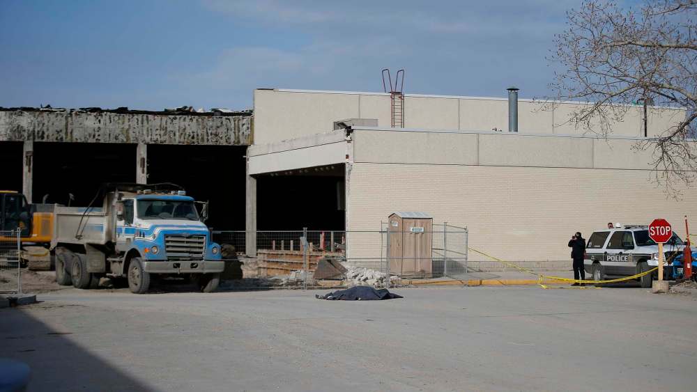 JOHN WOODS / WINNIPEG FREE PRESS Police investigate at the scene of a fatal pedestrian/truck collision in the Garden City Shopping Centre parking lot in Winnipeg Monday, April 1, 2019.