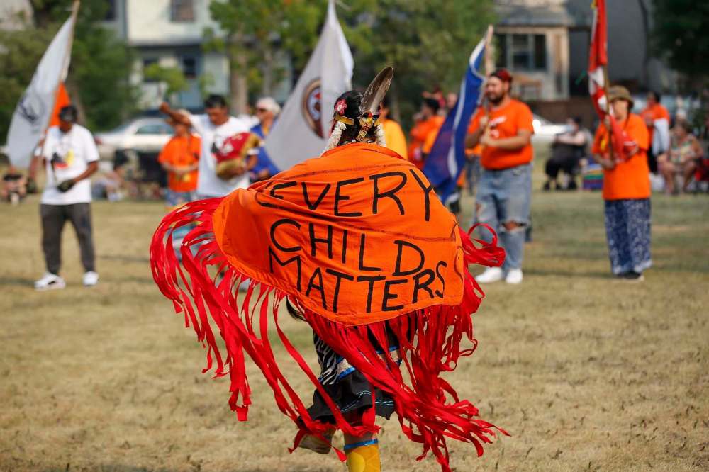 A dancer performs during the grand entrance at an Every Child Matters pop-up powwow at Vimy Ridge Park Sunday. About 100 people gathered for the event. (John Woods / Winnipeg Free Press)