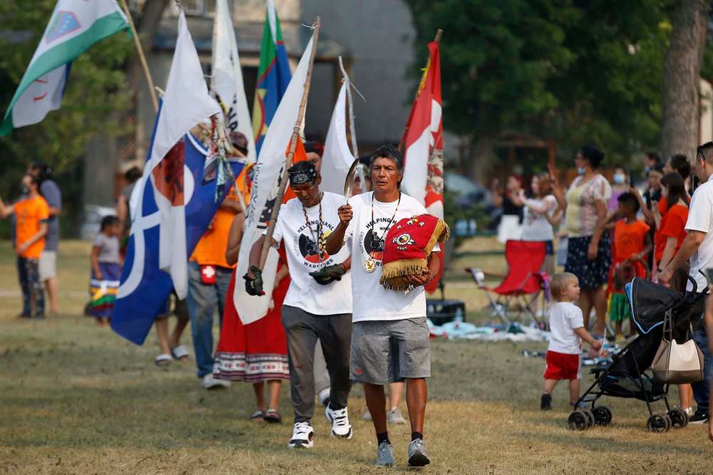 Adam McDonald leads the grand entrance at the Every Child Matters pop-up powwow. (John Woods / Winnipeg Free Press)