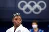 FILE - In this July 27, 2021 file photo, Simone Biles, of the United States, watches gymnasts perform after she exited the team final at the 2020 Summer Olympics, in Tokyo. Biles and Naomi Osaka are prominent young Black women under the pressure of a global Olympic spotlight that few human beings ever face. But being a young Black woman -- which, in American life, comes with its own built-in pressure to perform -- entails much more than meets the eye. (AP Photo/Ashley Landis, File)