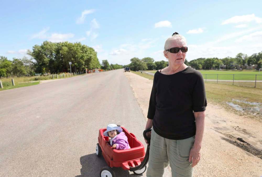 RUTH BONNEVILLE / WINNIPEG FREE PRESS
Val Klassen, towing her granddaughter along the trail, said members of her family have noted the trails have become more unsafe in recent years.
