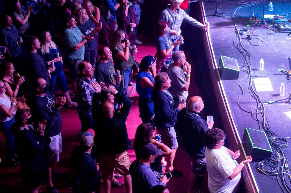 MIKE SUDOMA / Winnipeg Free Press
Audience members watch from the floor as the Northern Pikes finish a song at the Burton Cummings Theatre for the Burt Block Party event Friday. The event was moved indoors as rain fell outside.