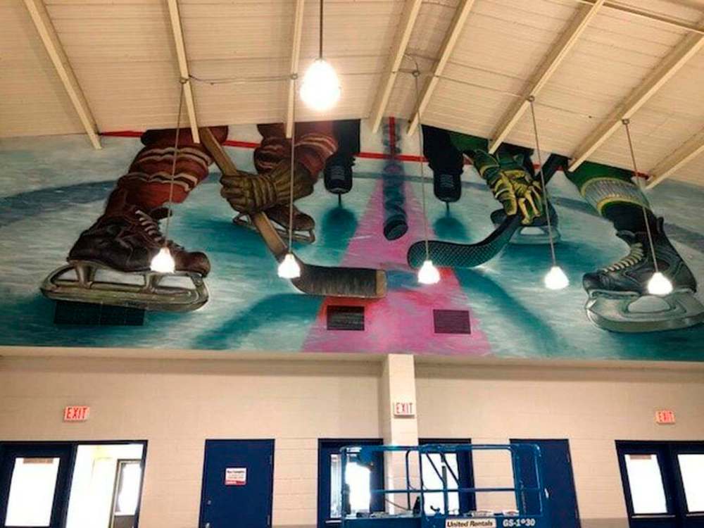 Supplied
The Charlie Johnston mural became a tribute to the Humboldt Broncos. On the day of the 2018 fatal bus accident, the muralist was painting the New Player and gave that character’s gear the team’s colours.