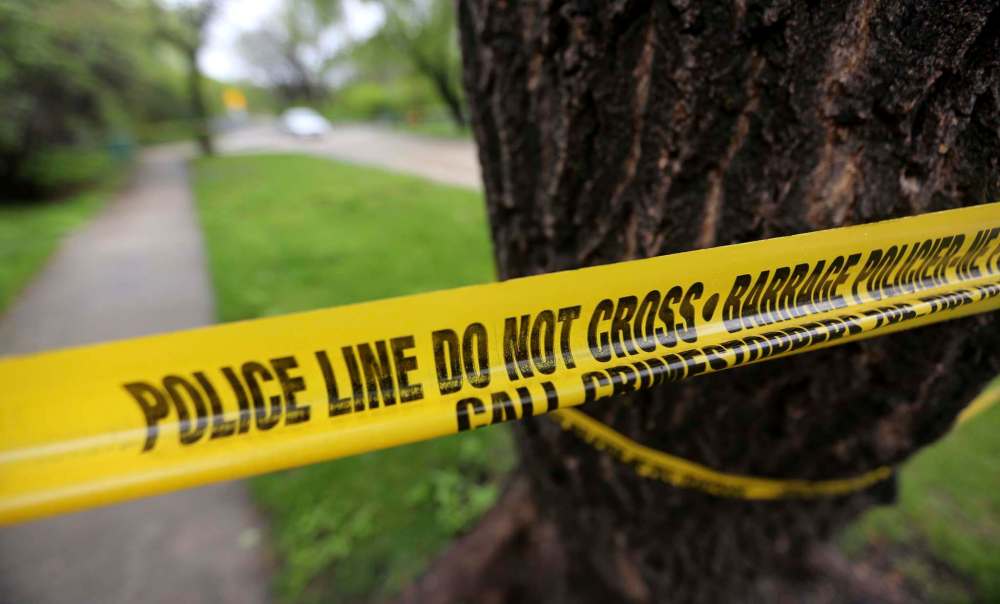 Police tape at the scene on Tremblay Street, Sunday, May 17, 2015. (TREVOR HAGAN/WINNIPEG FREE PRESS)