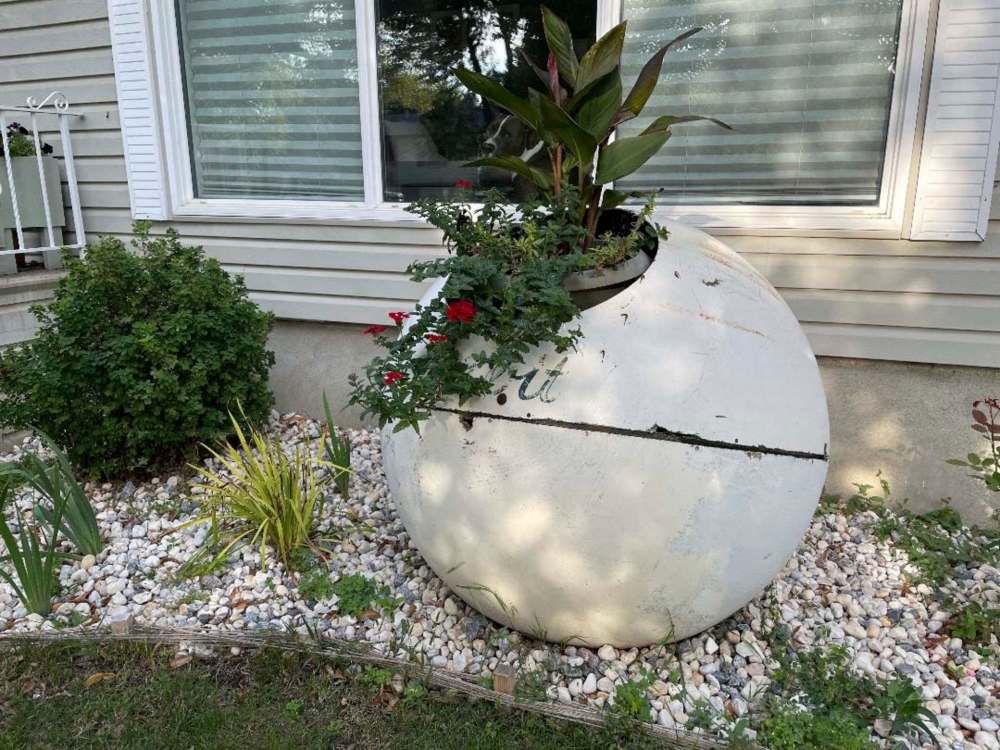 SUPPLIED
A former Orbit trash receptacle has been repurposed as a planter in a Winkler yard.