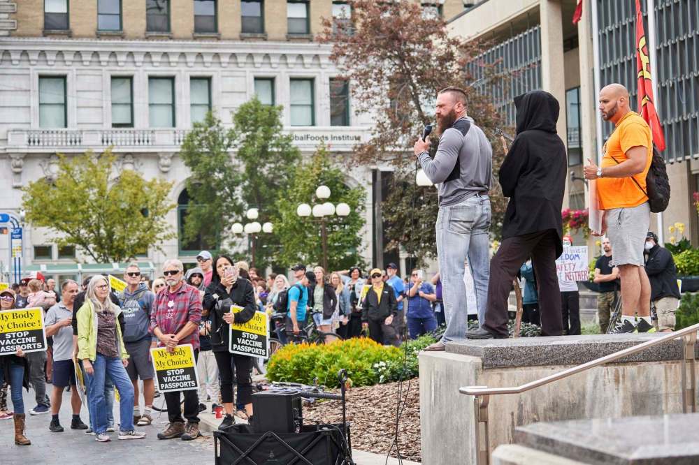 The decision to relocate the protest away from the hospital was done to prevent more of a divide, said protest organizer Shaun Zimmer (grey shirt). (David Lipnowski / The Canadian Press)