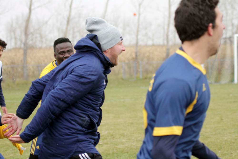 Coach Jesse Roziere celebrates after the final whistle of the Manitoba Colleges Athletic Conference men's soccer final against the Providence University College Pilots in Otterburne on Oct. 27, 2019. (Thomas Friesen / The Brandon Sun files)