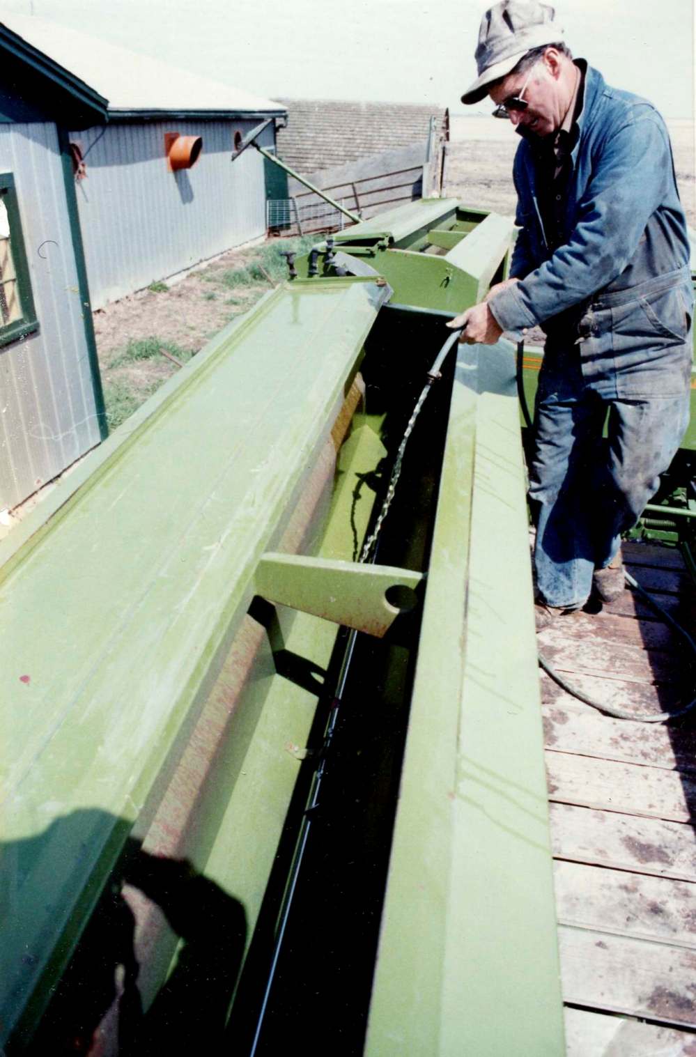 Leonard Rance with his seeder: The early zero-till drills used mechanics to manage seed placement. They were soon replaced by “air seeders” that used hydraulics to insert the seed with much improved precision. (Supplied)