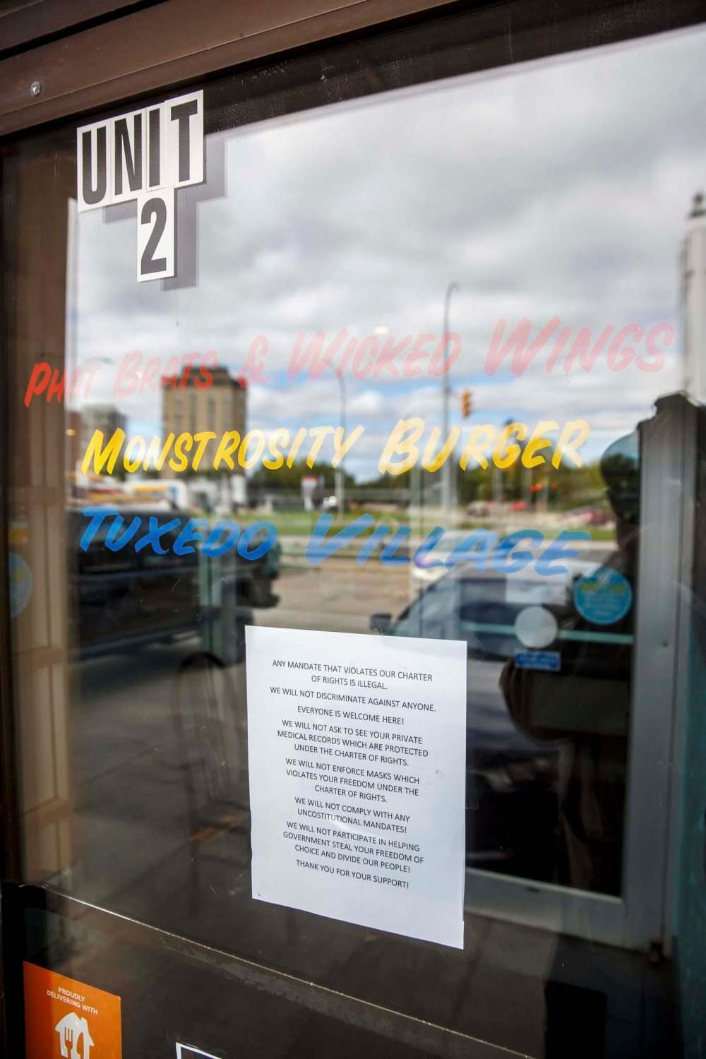 MIKE DEAL / WINNIPEG FREE PRESS
“We will not comply with any unconstitutional mandates!” reads a sign taped to the restaurants' door.
