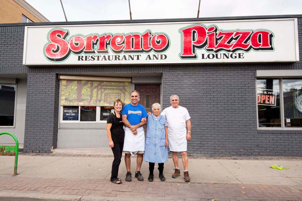 All in the family: Lomonaco’s sister Bri D’Ottavio (from left), Lomonaco, his mom, Antoinetta, and brother, Alfonso, in front of the Ellice Avenue location.