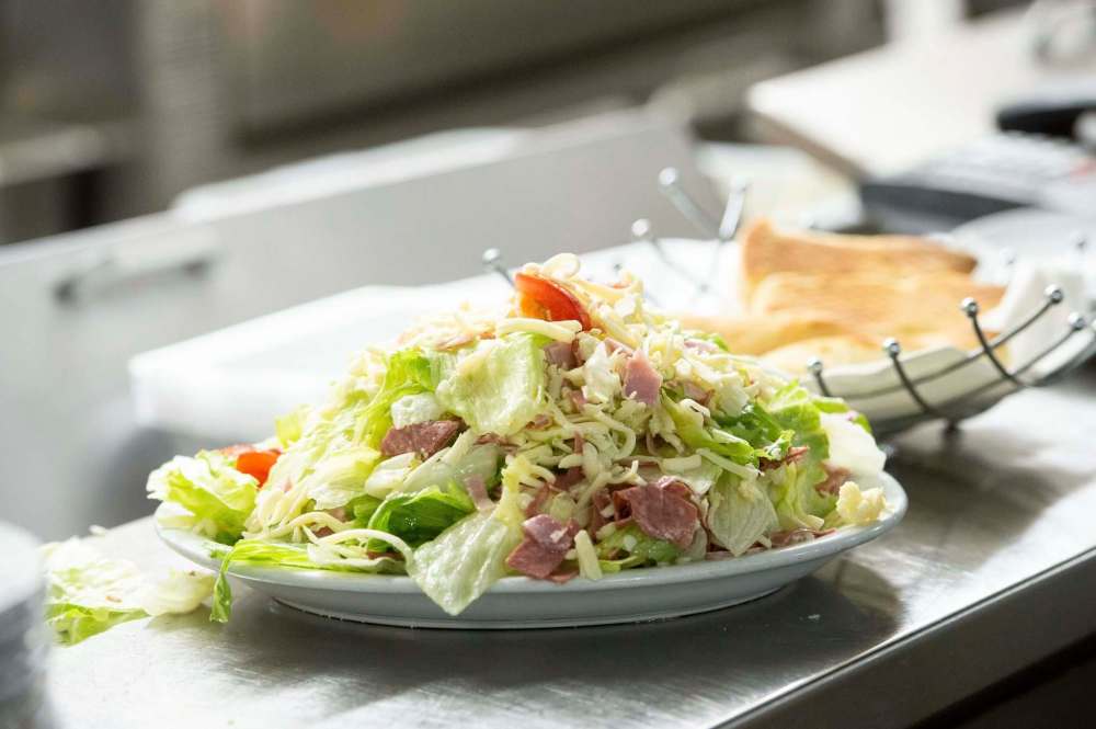 The Sorrento salad with ham and salami is a popular dish.