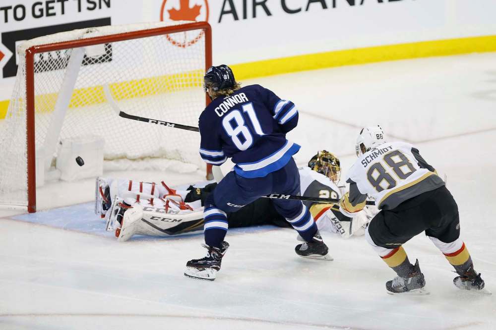 Now that they're teammates, Nate Schmidt (right) will be feeding passes to Kyle Connor instead of chasing him down. (John Woods / Winnipeg Free Press files)