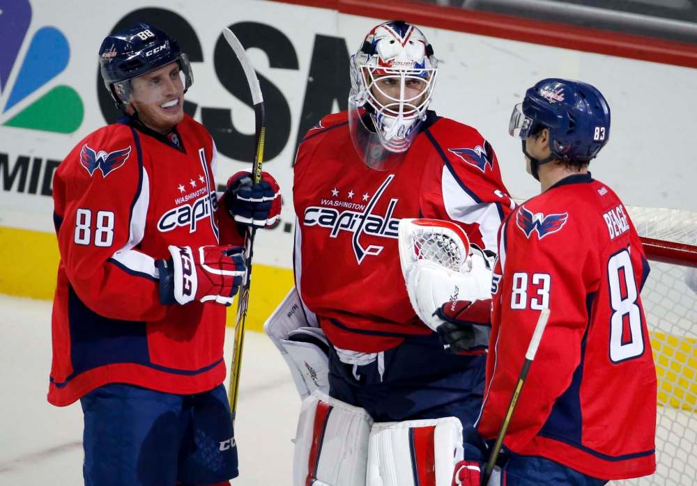Nate Schmidt (left), with former Washington Capitals teammates Braden Holtby (centre) and Jay Beagle, signed as an undrafted free agent after playing at the University of Minnesota. (Alex Brandon / The Associated Press files)