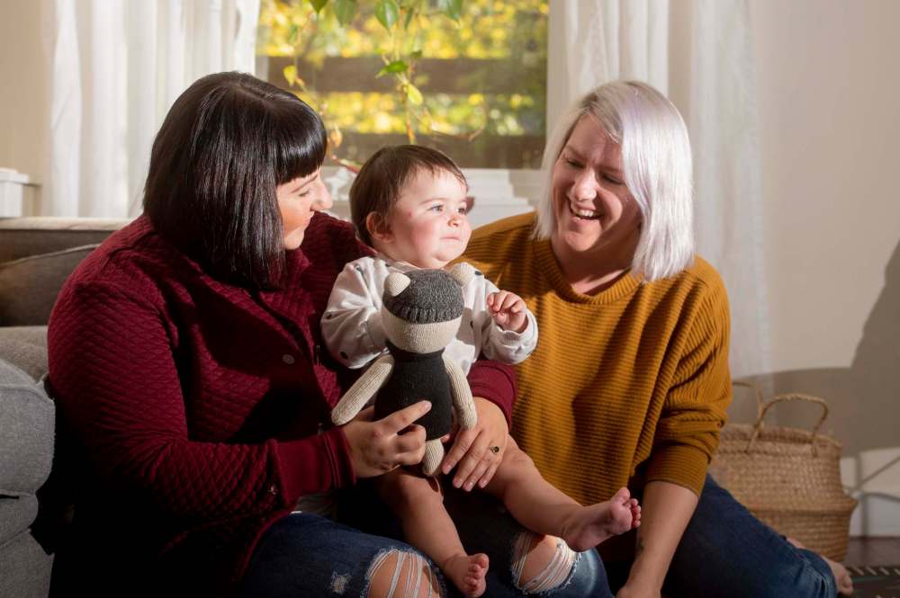 MIKE SUDOMA / Winnipeg Free Press
Brenlee Coates, right, her wife Amanda Karpinsky and their daughter Lark share a moment.