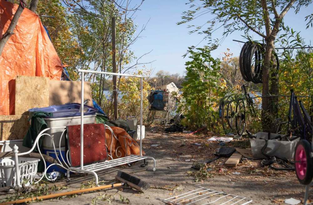 JESSICA LEE / WINNIPEG FREE PRESS
This is one of the safest and most comfortable places for someone experiencing homelessness in Winnipeg to be, says a man digging a fire pit in the encampent.