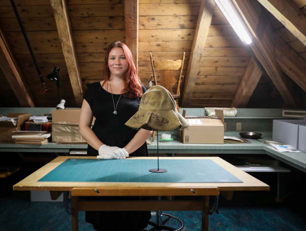 Among the items at the St. Boniface Museum is this hat, which belonged to curator Emilie Bordeleau-Laroche’s great-great grandfather Alfred Desorches, who fought in the 1885 Battle of Frog Lake. The suede hat bears marks of that battle and others. (Jessica Lee / Winnipeg Free Press)