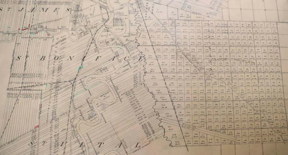An old map that shows land divisions in Winnipeg is stored in the backroom of the St. Boniface Museum. (Jessica Lee / Winnipeg Free Press)