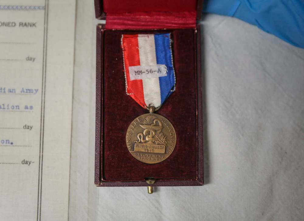 In addition to Dr. Louis Collin’s war-service medal, the museum acquired his uniform, surgical instruments and medical textbooks. (Jessica Lee / Winnipeg Free Press)