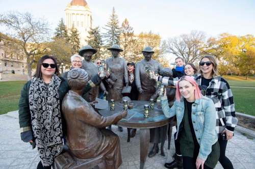 photos by MIKE SUDOMA / Winnipeg Free Press

From left: Josie Cannon, Cory Krul, Kyla Dumanski, Erica Campbell, Brooklyn Krul, Kelli Wiklund, Danielle Strachan, and Shelby Guthrie, cheers Torque&rsquo;s new beer, Whoa Nellie, in front of the Group of 5 statue.