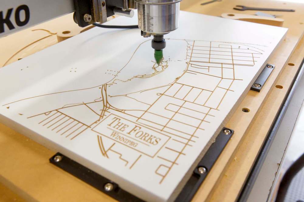 MIKE DEAL / WINNIPEG FREE PRESS Kevin Morissette is the brains behind Lake Depth Maps. Three years ago he handmade a three-dimensional map of Clear Lake for a friend, using a scalpel to carve out the various depths. Everybody who saw it loved it, he made close to 30 more before investing a chunk of change in a digital router, which he now uses to turn out maps of lakes not just in Manitoba, but Ontario, BC, California, even the Philippines, using Google Maps and fishing depth chart websites to accurately recreate the body of water in question. See Dave Sanderson Intersection story 211026 - Tuesday, October 26, 2021.