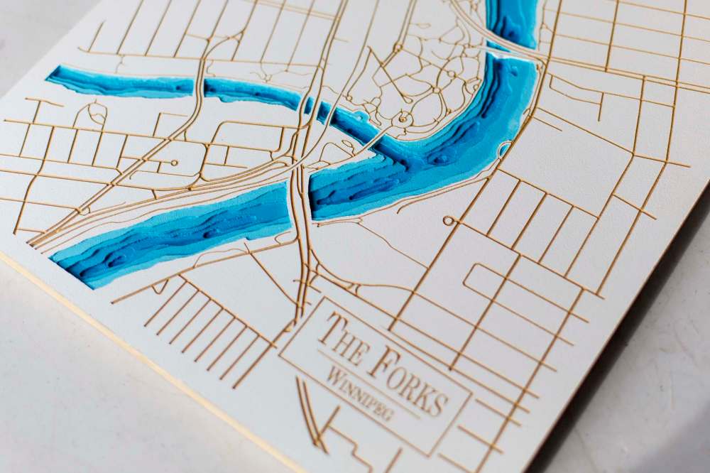 MIKE DEAL / WINNIPEG FREE PRESS Kevin Morissette is the brains behind Lake Depth Maps. Three years ago he handmade a three-dimensional map of Clear Lake for a friend, using a scalpel to carve out the various depths. Everybody who saw it loved it, he made close to 30 more before investing a chunk of change in a digital router, which he now uses to turn out maps of lakes not just in Manitoba, but Ontario, BC, California, even the Philippines, using Google Maps and fishing depth chart websites to accurately recreate the body of water in question. See Dave Sanderson Intersection story 211026 - Tuesday, October 26, 2021.
