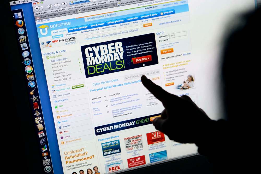 Canadians plan to spend $542 over the Black Friday-Cyber Monday weekend, according to the Shopify poll. (Paul Sakuma / The Associated Press files)