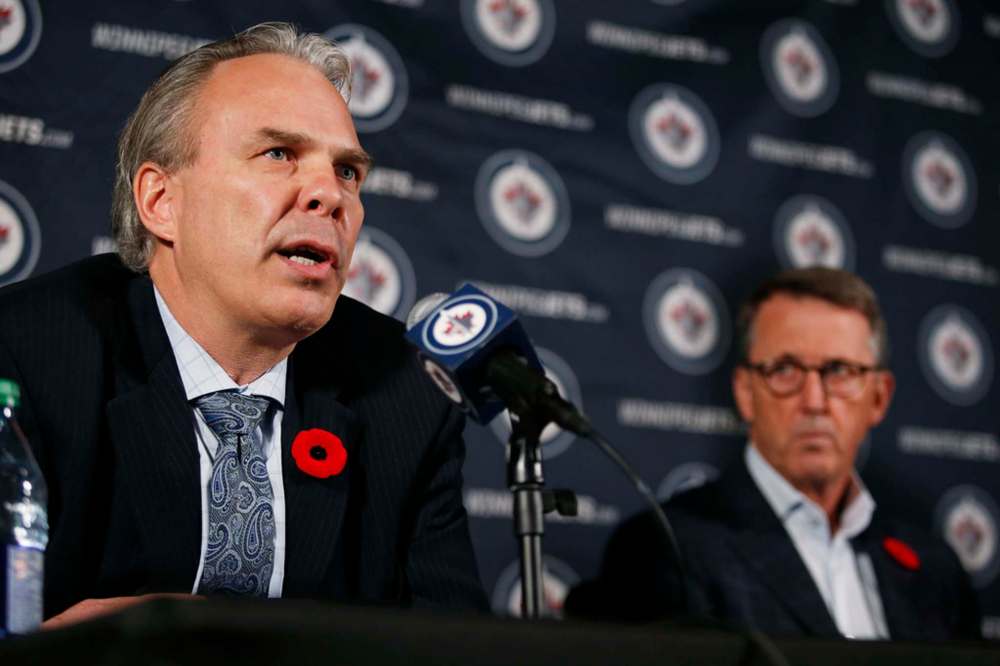 Winnipeg Jets General Manager Kevin Cheveldayoff (left) speaks to media regarding his role in the Chicago Blackhawks sexual abuse report in Winnipeg Tuesday. (John Woods / Winnipeg Free Press)