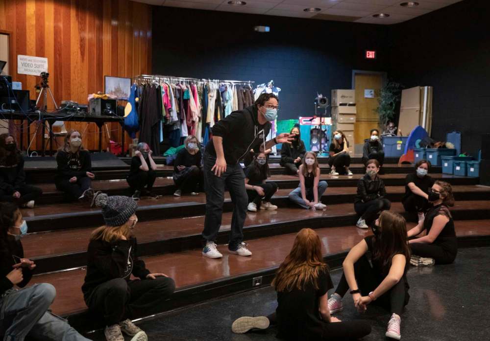 Drama teacher Kyle Collins demonstrates an acting exercise to the school theatre troupe. (Jessica Lee / Winnipeg Free Press)