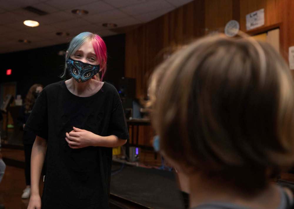 Marah Gervais (left), 12, practices an improv exercise with a partner during theatre class. (Jessica Lee / Winnipeg Free Press)