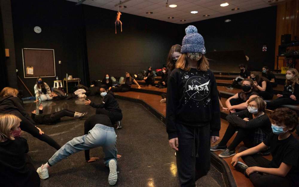 Avalene Iwasiow (wearing toque and blindfolded), 12, is guided verbally by partner Salina Lupu (behind), 13, to walk through an enchanted forest. (Jessica Lee / Winnipeg Free Press)
