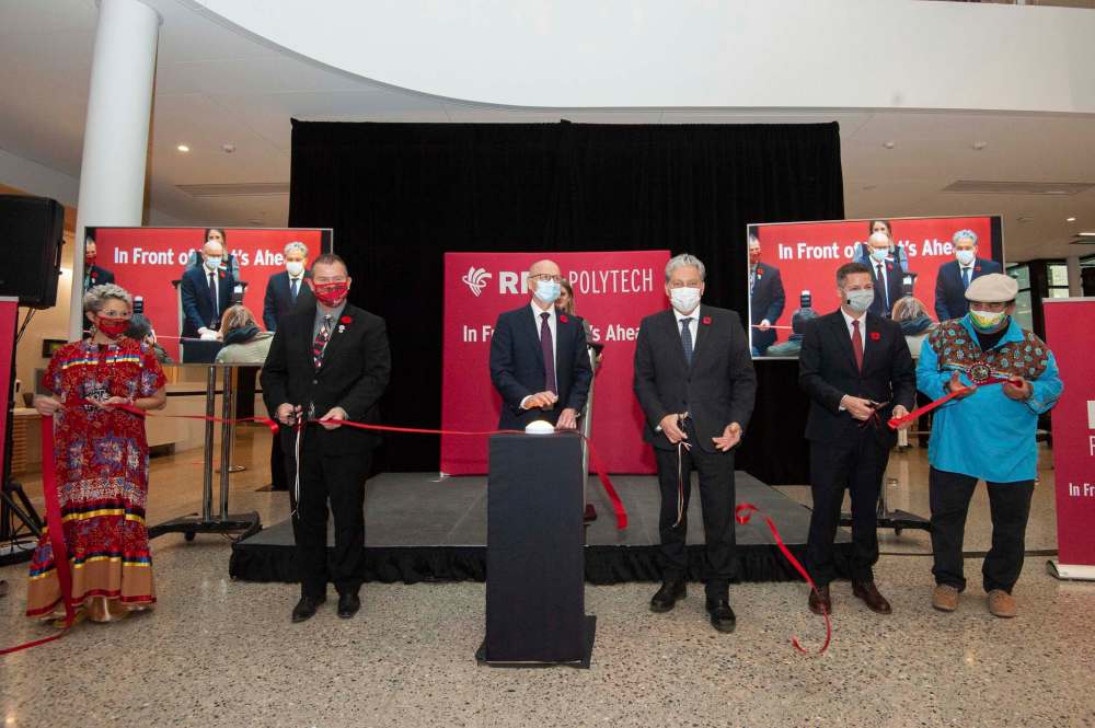 Mike Sudoma / Winnipeg Free Press
From left: Una Swan, Wayne Ewasko, Fred Meier, Dan Vandal, Brian Bowman and Paul Guimond participate in cutting a ribbon to announce the official opening of Red River College Polytechnic’s innovation centre.