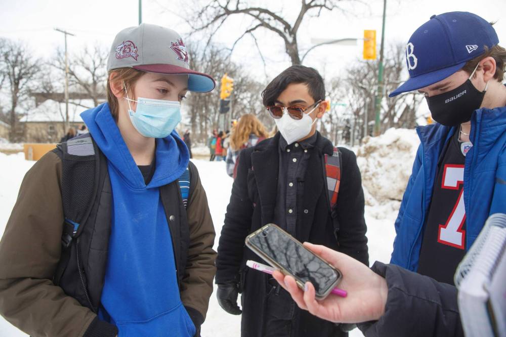 MIKE DEAL / WINNIPEG FREE PRESS
(from left) Nathan Iwanchuk, Devon Francisco, and Liam Thomson, grade 9 students from Kelvin High School took part in the walkout along with around 100 other students during the middle of class to raise awareness of lack of student safety.