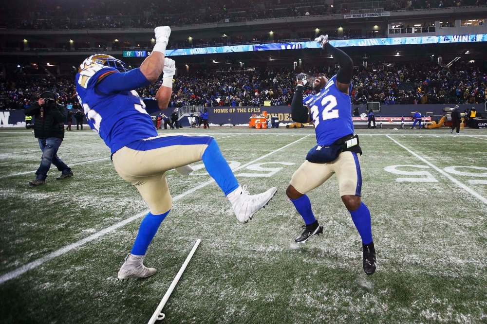 John Woods / Canadian Press files
Blue Bombers Andrew Harris (left) and Deatrick Nichols do their best happy dance after defeating the Saskatchewan Roughriders Sunday at IG Field.
