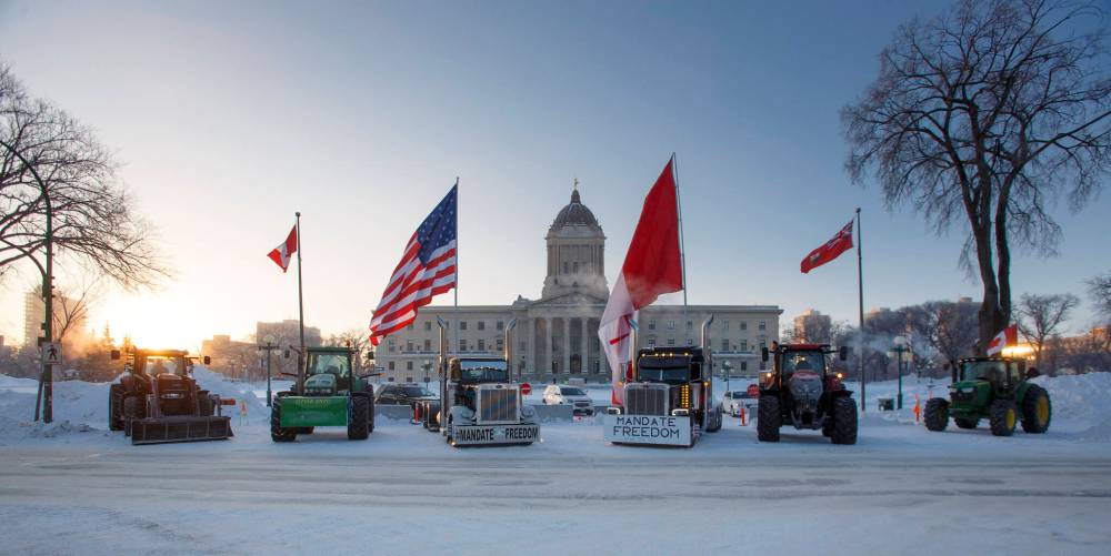 Trucks parked on Broadway as part of the protest. (Mike Deal / Winnipeg Free Press)