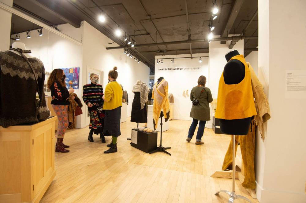 Mike Sudoma / Winnipeg Free Press
Visitors to the C2 Centre for Craft check out handmade and naturally dyed clothing items made by Manitoban artists for The One Year, One Outfit Challenge.
