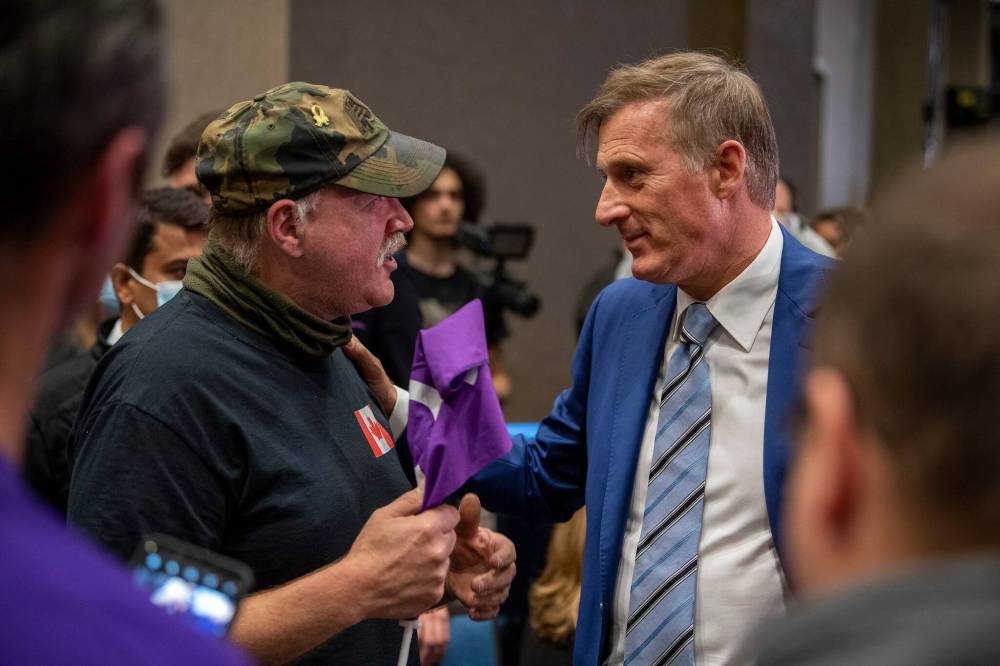 LIAM RICHARDS / THE CANADIAN PRESS FILES
People’s Party of Canada Leader Maxime Bernier, right, was charged with breaching requirements of self-isolation after entering Manitoba and exceeding public gathering limits.