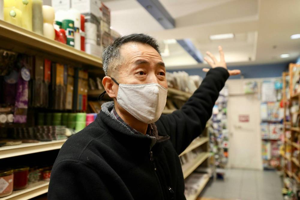 Besides dealing with a drop in sales, Deals for Dollars owner Jong Sung Jung Jung says his business has been broken into twice since the beginning of this year. (Ruth Bonneville / Winnipeg Free Press)