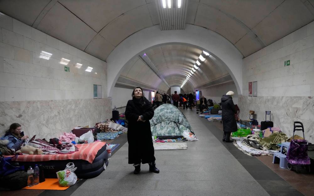 People gather in the Kyiv subway, using it as a bomb shelter in Kyiv, Ukraine, Wednesday, March 2, 2022. Russian forces have escalated their attacks on crowded cities in what Ukraine’s leader called a blatant campaign of terror. (AP Photo/Efrem Lukatsky)