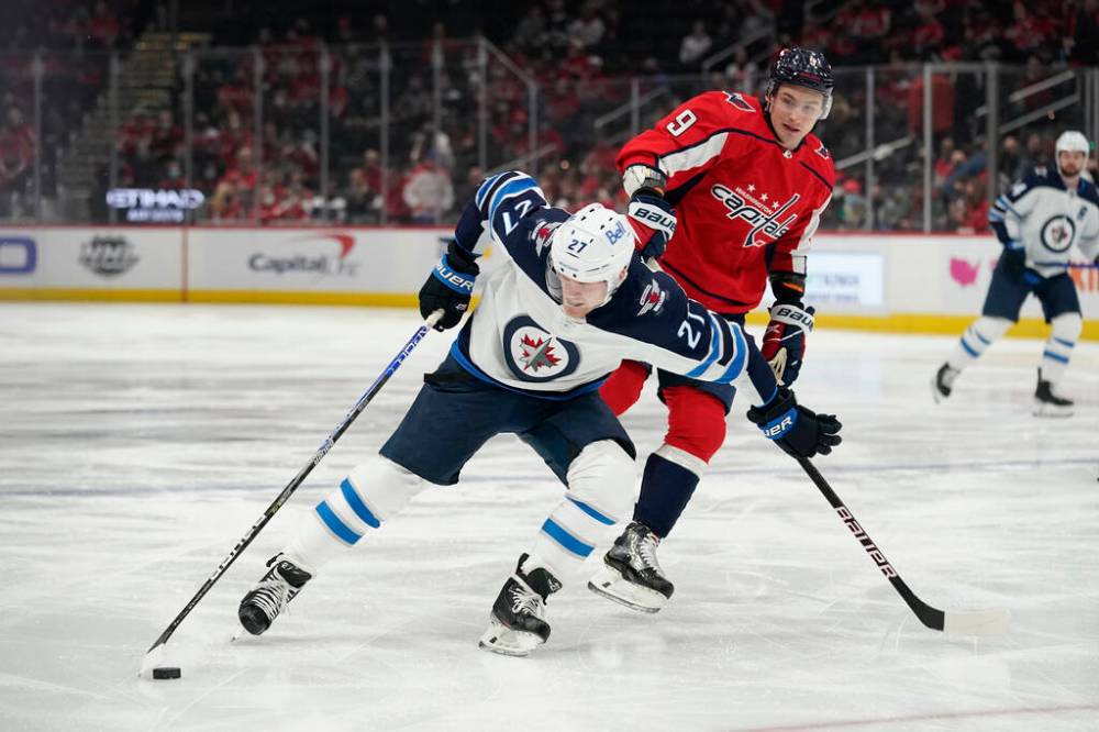 Nikolaj Ehlers took a knee-on-knee hit from Washington’s Dmitry Orlov on Jan. 18 that was ignored. (Patrick Semansky / The Associated Press files)