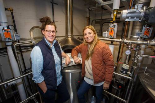 MIKE DEAL / WINNIPEG FREE PRESSGood Neighbour Brewing co-owners Morgan Wielgosz (left), who is also the brew master, and Amber Sarraillon.